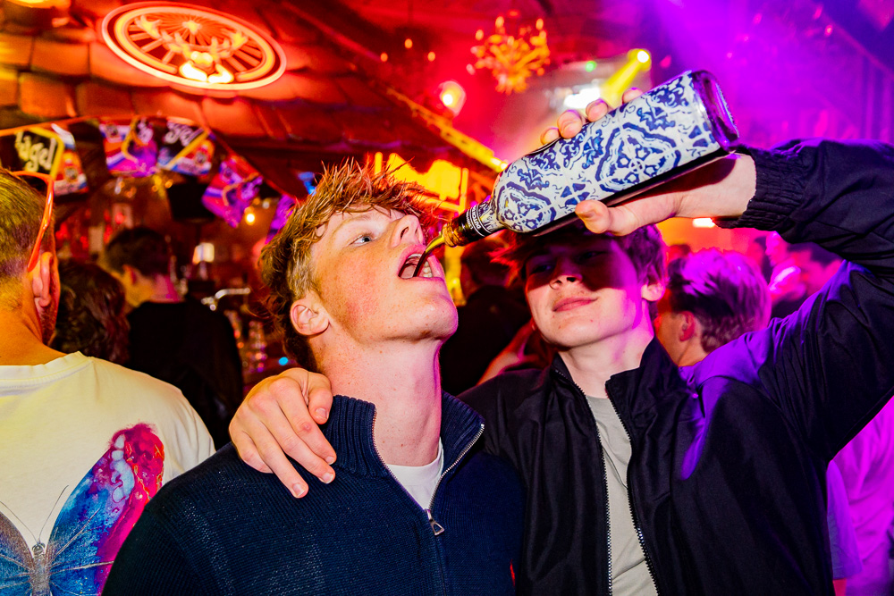 Photography of two people enjoying a drink during a night out